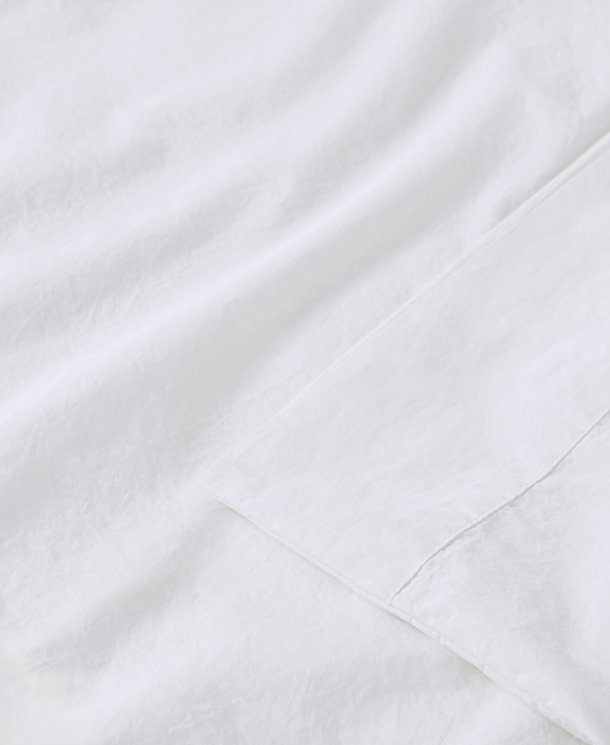 White marble surface with subtle gray veining and natural stone texture patterns